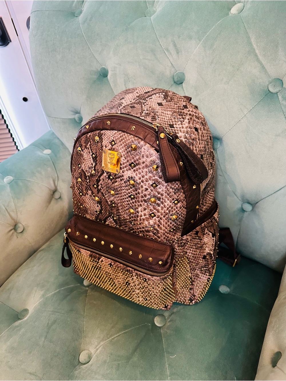 MCM Brown Python-Print Studded Backpack with Gold Accents